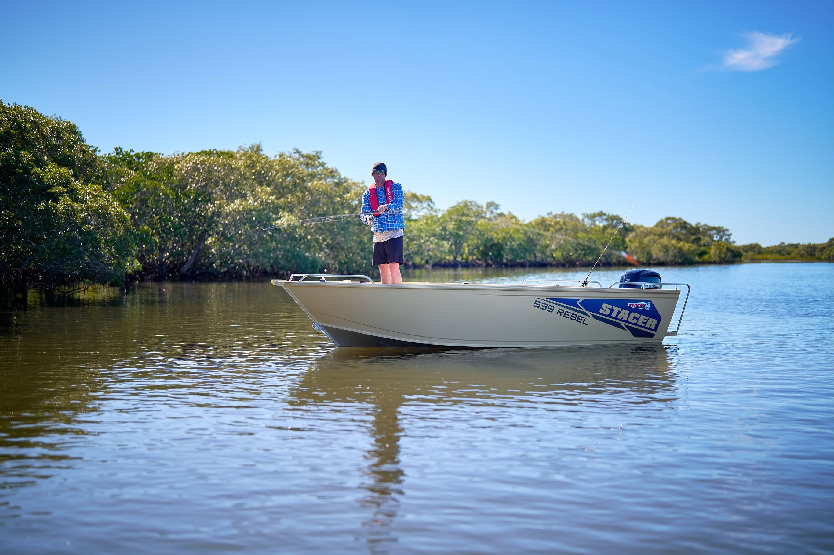 man fishing on top of a casting platform on a Stacer Rebel boat